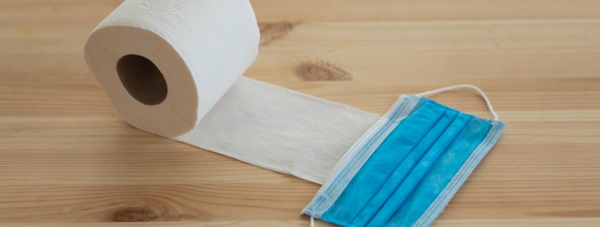 white toilet paper roll on brown wooden table