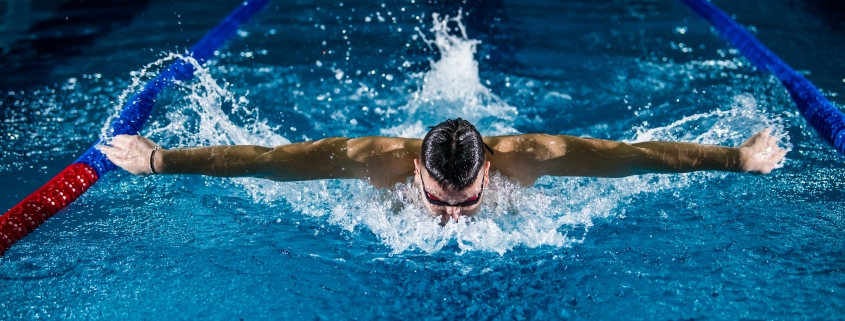 man doing butterfly stroke