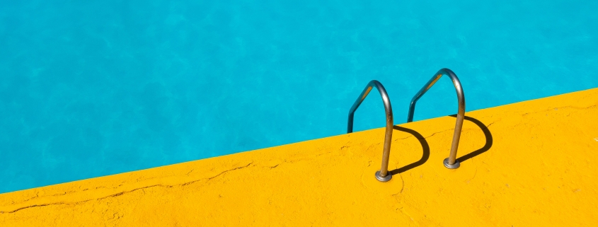 swimming pool with stainless steel ladder